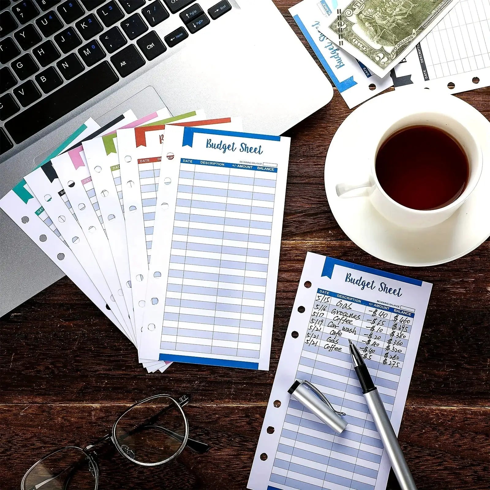 60 Pcs A6 glossy budget sheets by Simples Market for envelope planner; six-ring binder compatible on desk