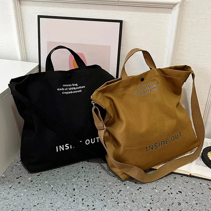 Canvas crossbody bags in black and tan with long straps, large capacity by Simples Market, INSIDE OUT print.