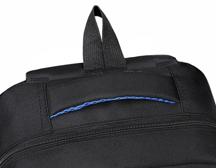 Backpack, black with blue accent, top carry handle and zip-pocket detail