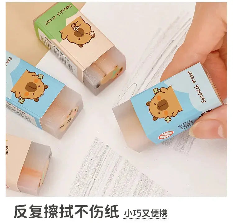 Capybara erasers set by Simples Market; pastel blue and beige packaging shows cute cartoon capybara designs