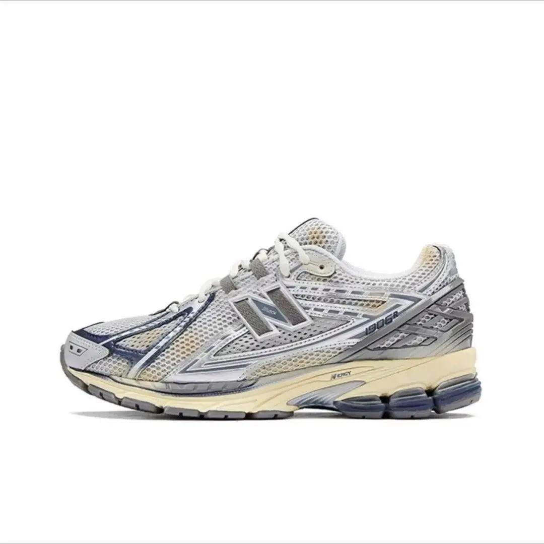 1906R running shoe with breathable gray mesh upper and beige midsole