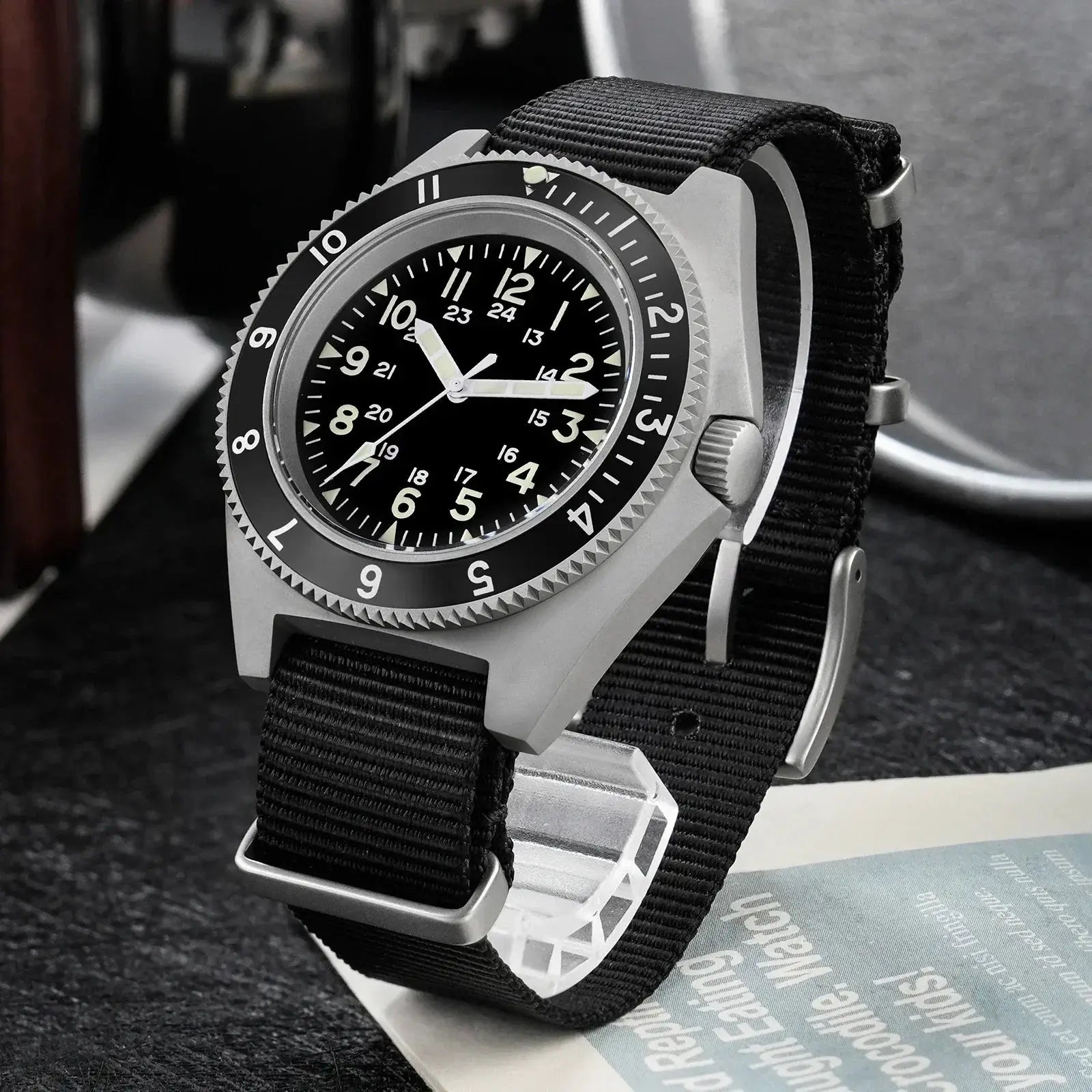 Watchdives WD1972 quartz wristwatch with black dial, luminous hands, steel case, and black nylon strap.