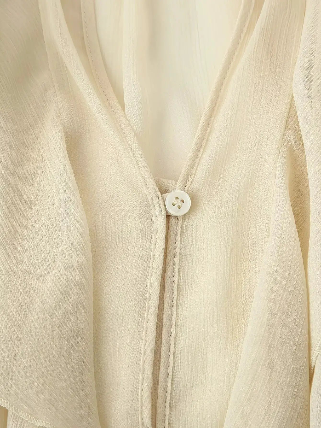 YENKYE cream semi-sheer blouse with V-neck and front button, long sleeves