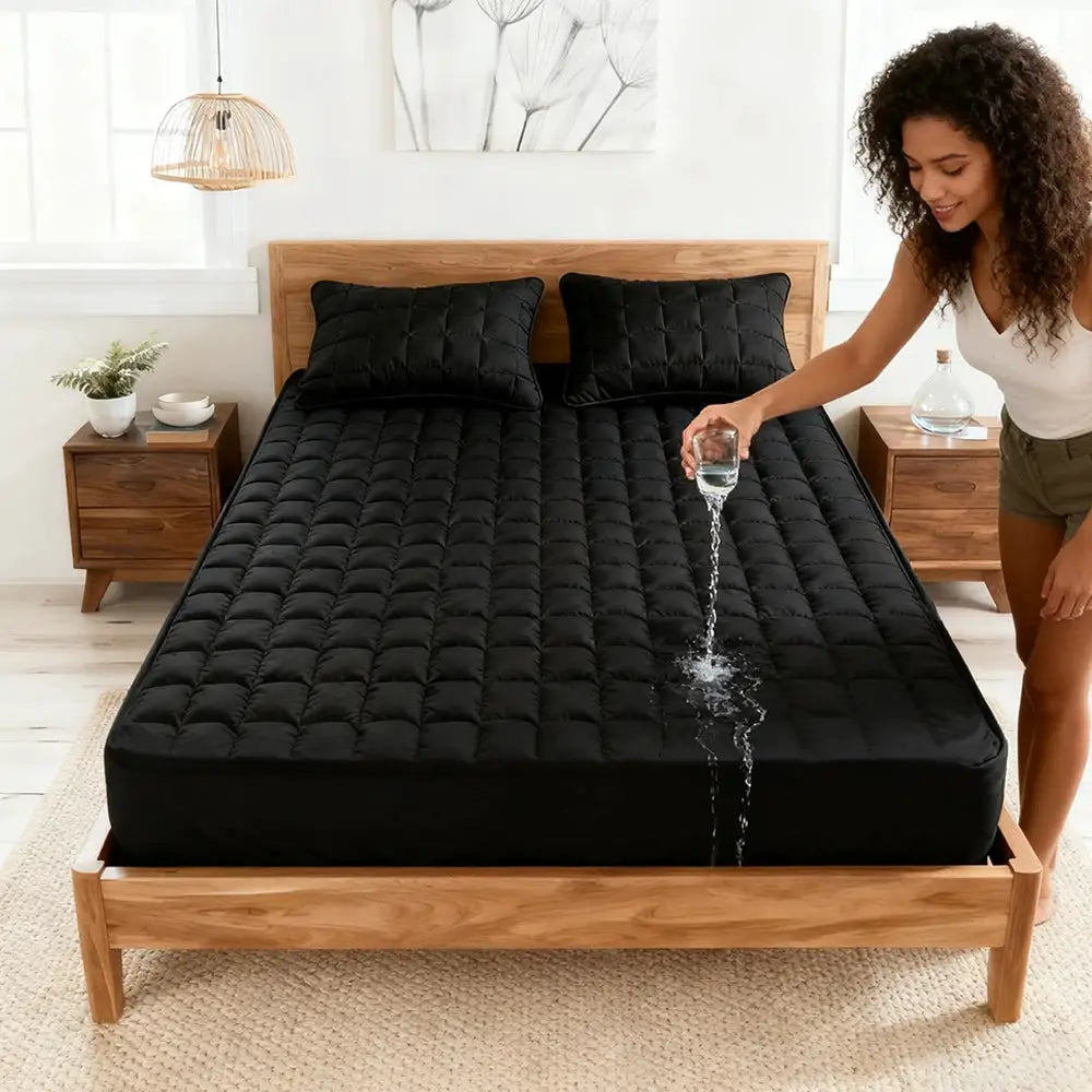 Simples Market 1pc waterproof quilted mattress protector, black, on a wooden bed with water test