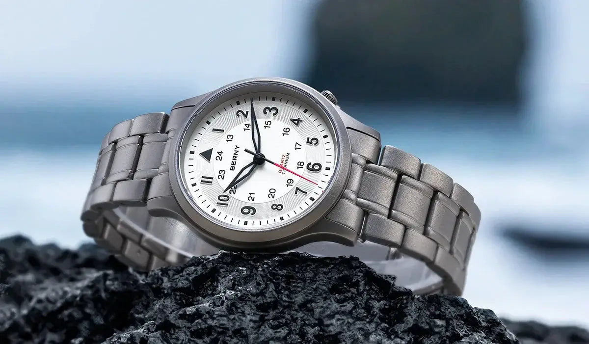 BERNY titanium men's field watch on a silver metal bracelet with a white, easy to read dial and luminous hands