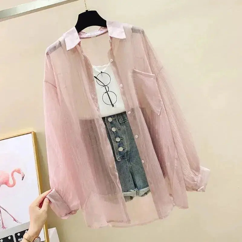 Pink sheer chiffon blouse with white collar, long sleeves, button-down, worn with white tee and denim shorts