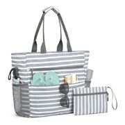 Waterproof foldable beach tote bag in gray stripes with front pockets and matching pouch.