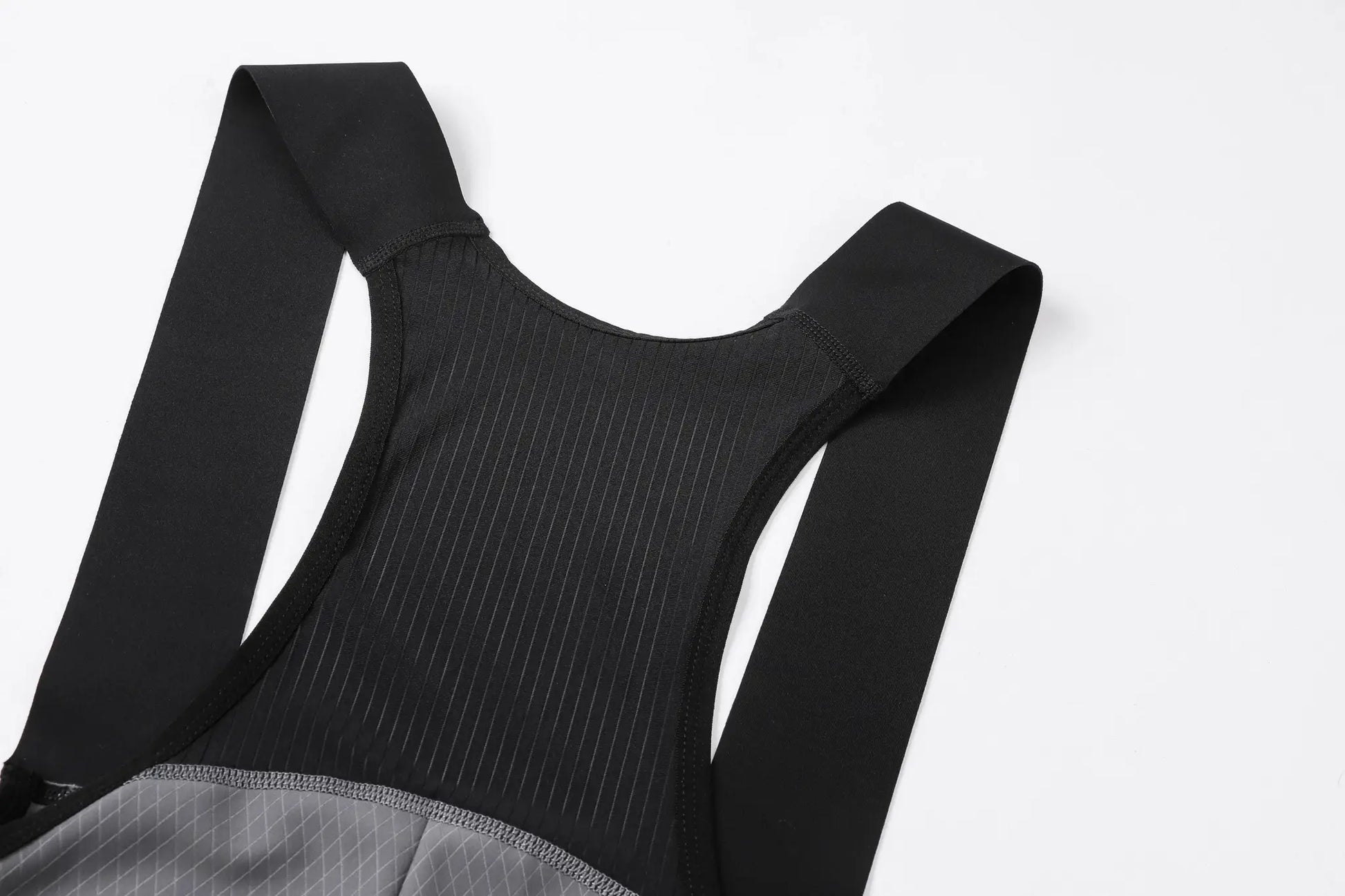 Black cycling bib shorts with wide shoulder straps and grey pinstriped lining