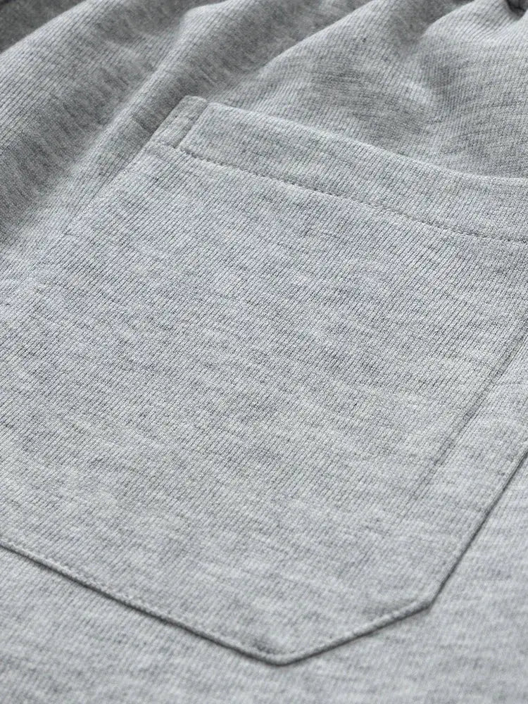 Men's gray cotton sweatpants with a front patch pocket for casual comfort