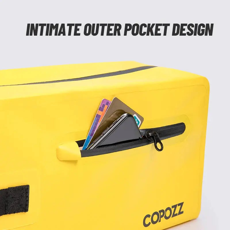 Gym bag yellow with front zipper pocket, COPOZZ logo visible, contents include cards and phone