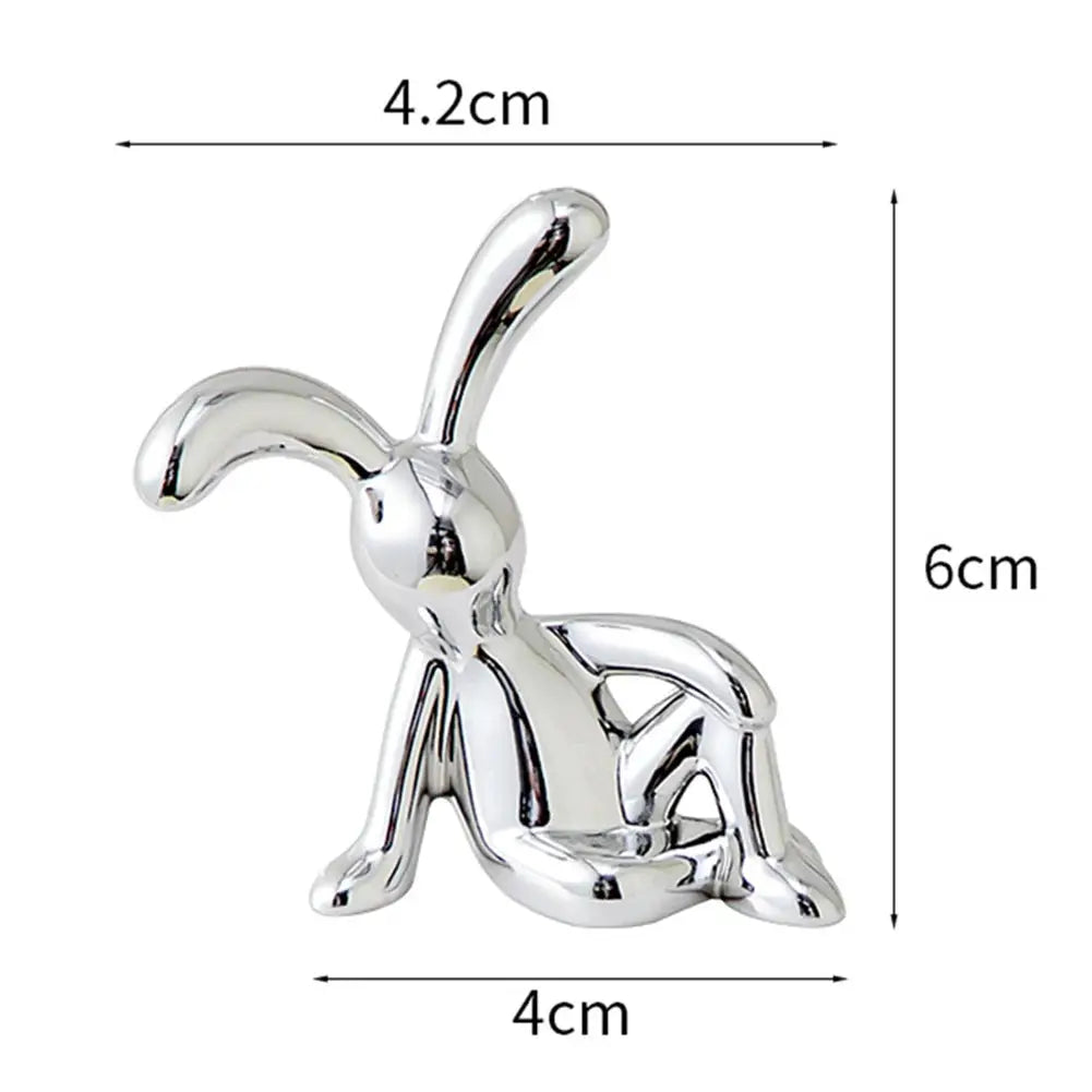 Chrome rabbit figurine for car interior center console decor, silver metal, 6 cm tall.