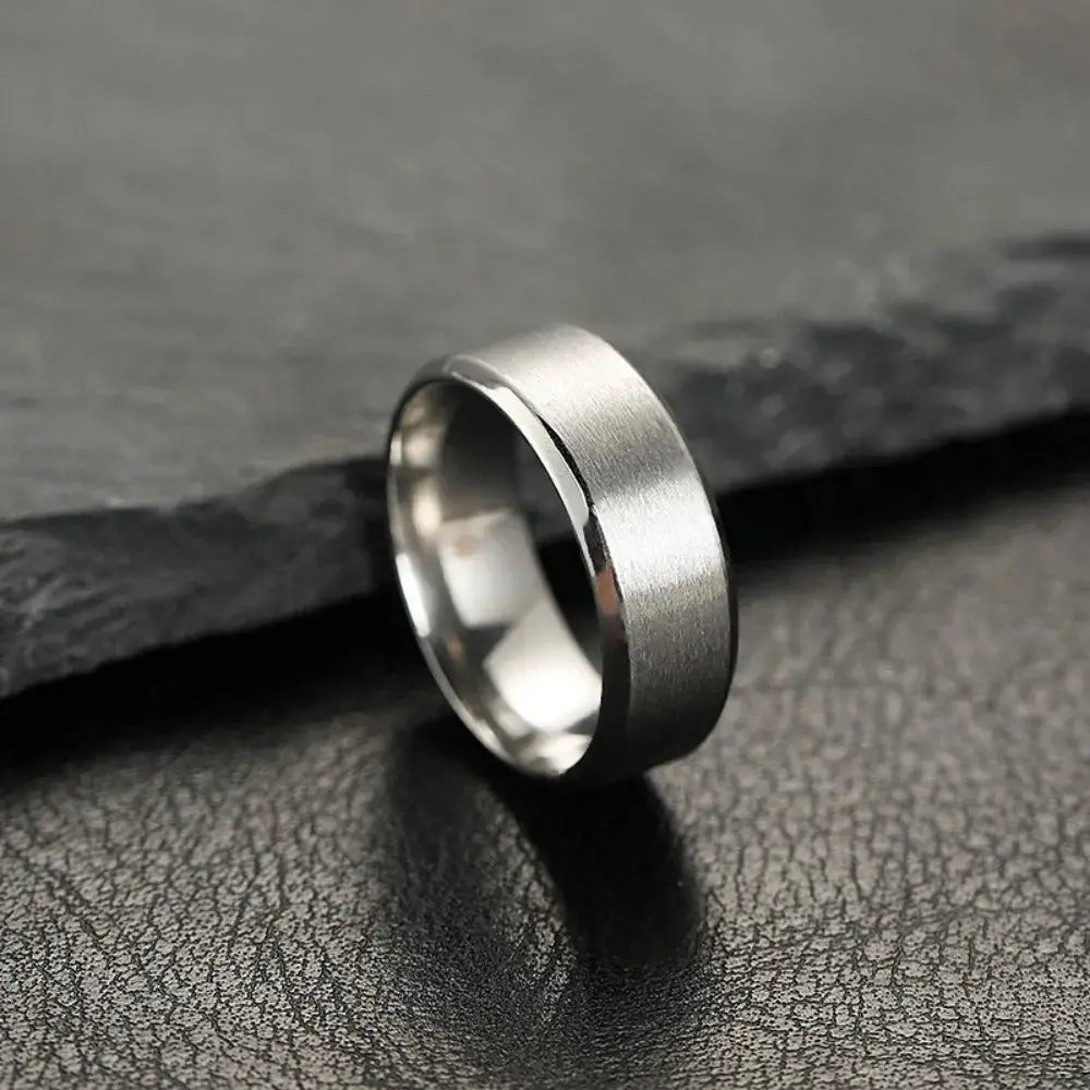 Unisex stainless steel ring with black matte outer finish and polished inner band.