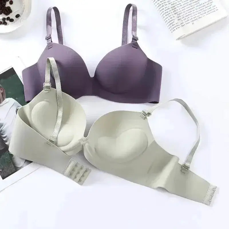 Two-pack women's seamless wireless bra set: purple and nude beige 3/4 cup bralettes.
