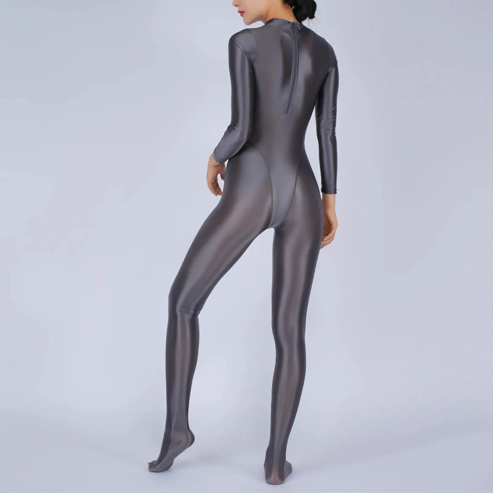 Women's full-body jumpsuit in metallic gray with long sleeves, footed design and back zipper