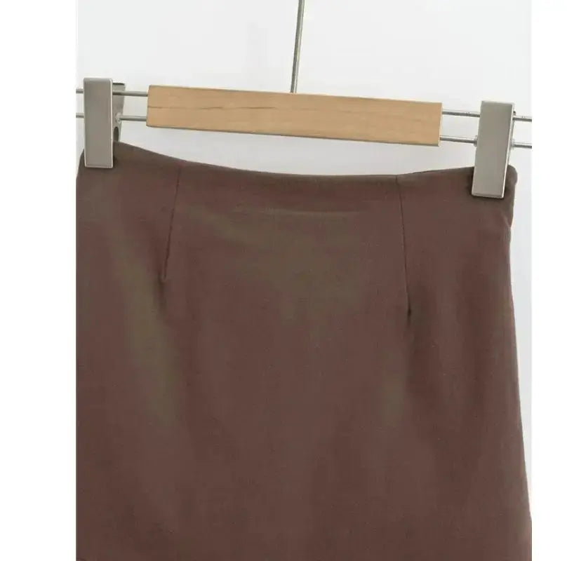 Women's brown A-line skirt by Simples Market, solid color, knee-length on hanger