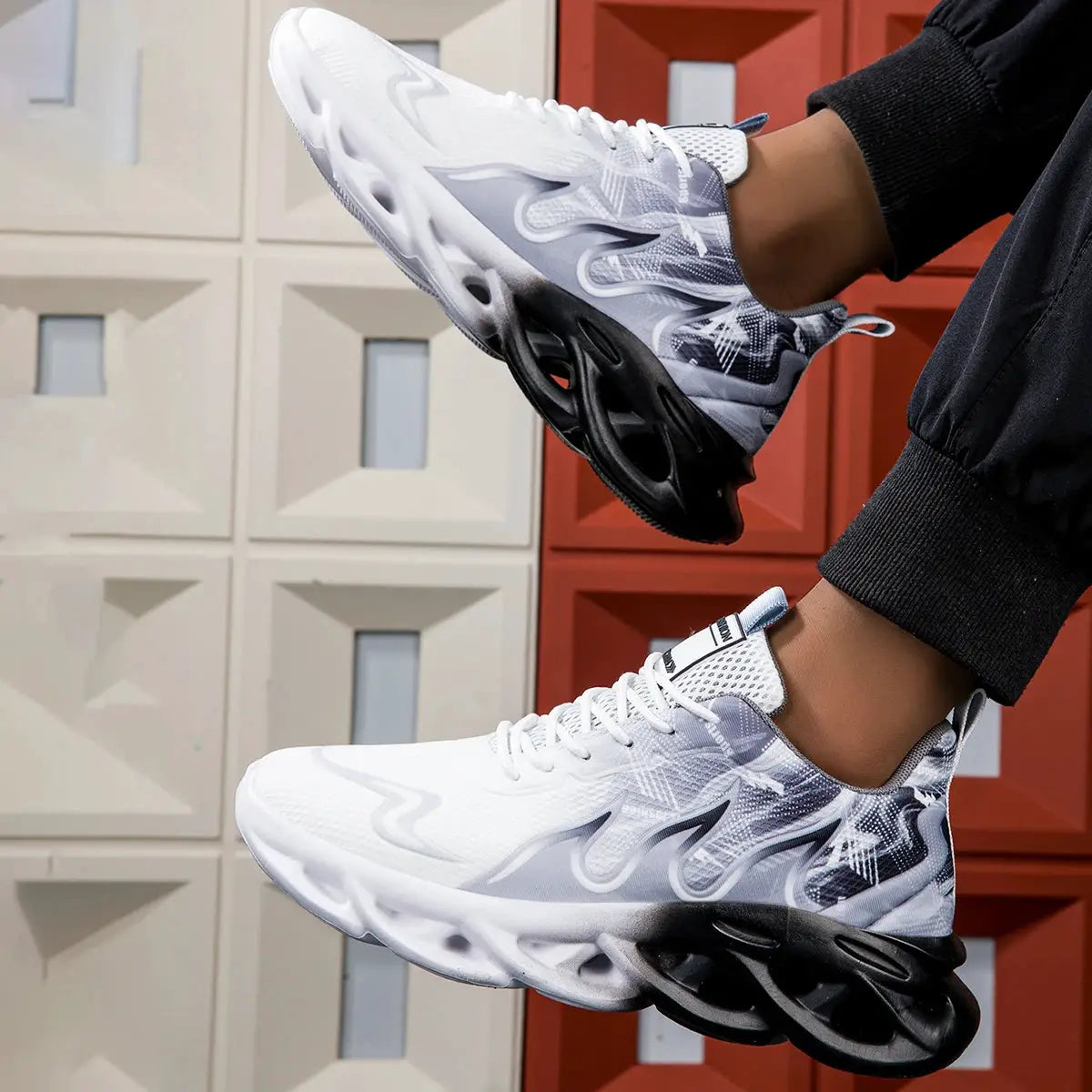 Unisex running shoes pair in white and gray mesh with black sculpted sole