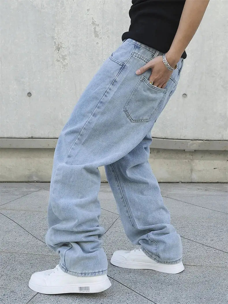 Men's baggy light-wash denim jeans with oversized straight legs for streetwear style.