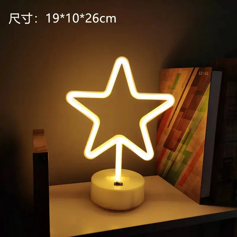 Star-shaped USB neon lamp on a round white base with warm yellow glow for desk or bedside decor.