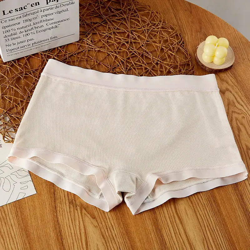 Beige mid-rise seamless women's boyshort underwear with pale pink trim