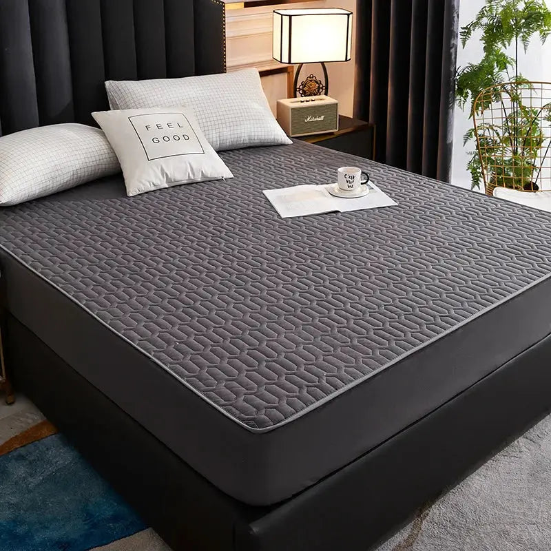 Waterproof quilted gray mattress cover on bed; skin-friendly fitted sheet protector (150/160/180x200)