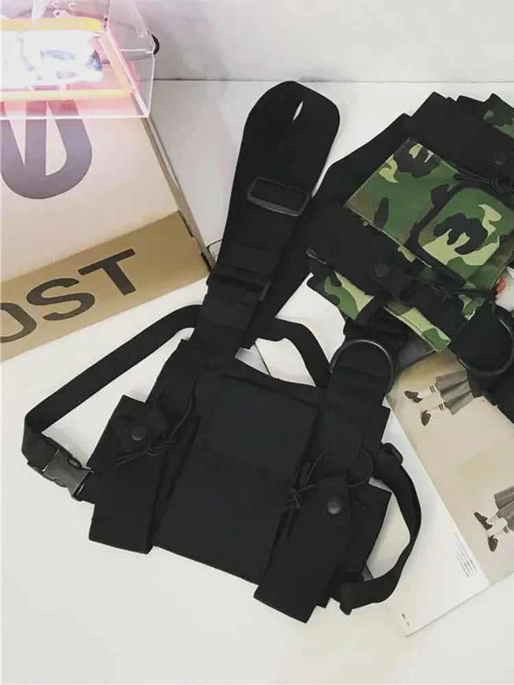 Two-piece tactical chest rig; black bag with pockets and adjustable straps, plus camo pouch