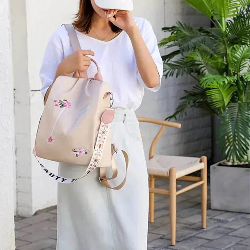 Waterproof Oxford women backpack by Simples Market with beige embroidery, anti-theft design, large capacity bag