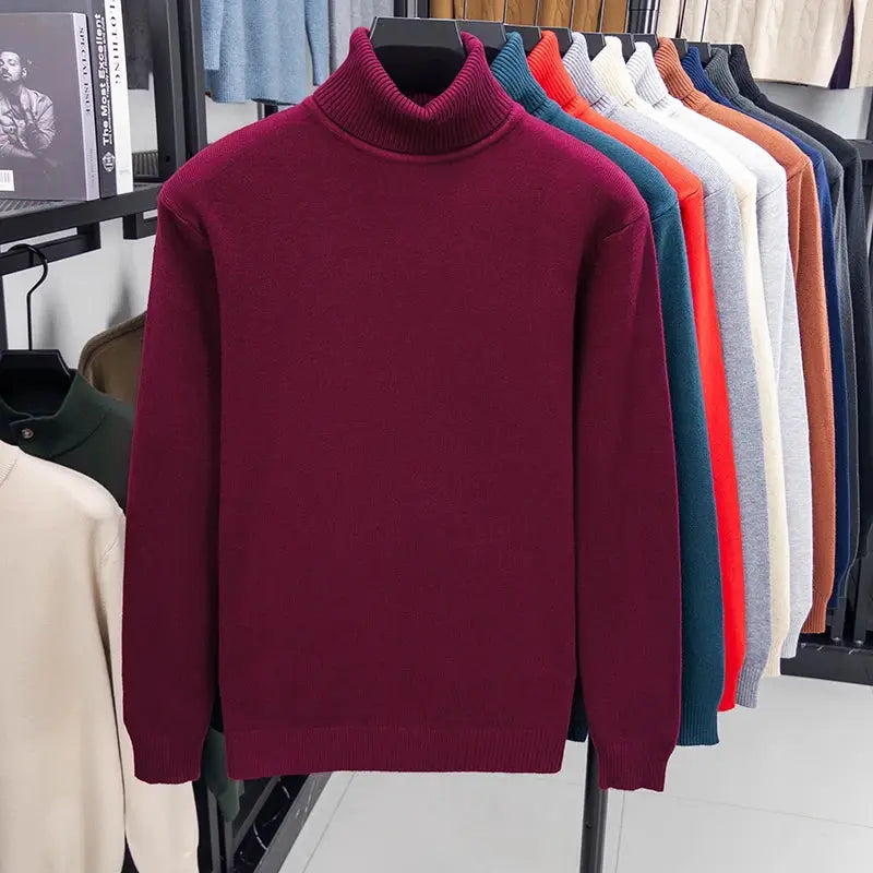 Men's burgundy knitted turtleneck sweater; solid color anti-pilling knit, on display with multiple color options on rack