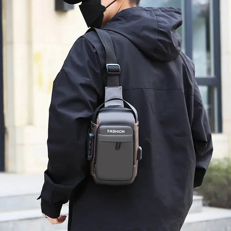 Men's anti-theft chest bag crossbody; gray front panel with brown trim and a FASHION label