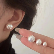 Set of four white pearl stud earrings in 925 sterling silver, varying sizes