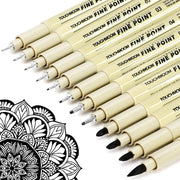 Touchmon fineliner pen set with beige barrels and fine-point tips arranged diagonally beside a black mandala design.