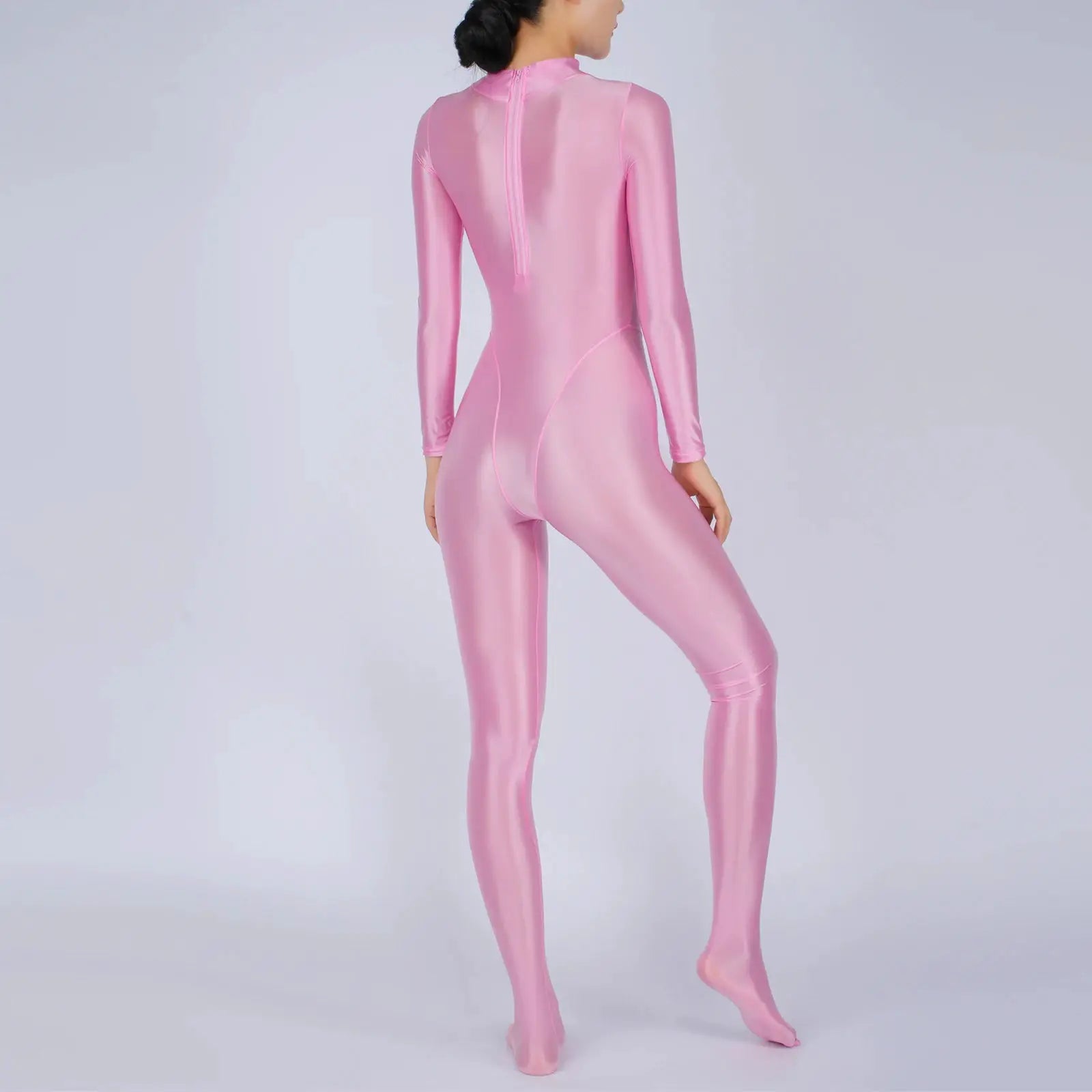 Pink shiny full-body jumpsuit with long sleeves and footed design, back zipper