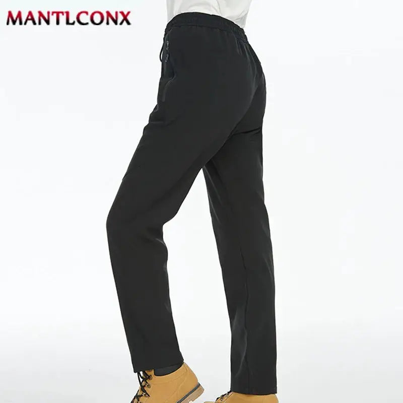 Men's black breathable jogger pants with elastic waist, straight-leg, quick-dry fabric, MANTLCONX logo.