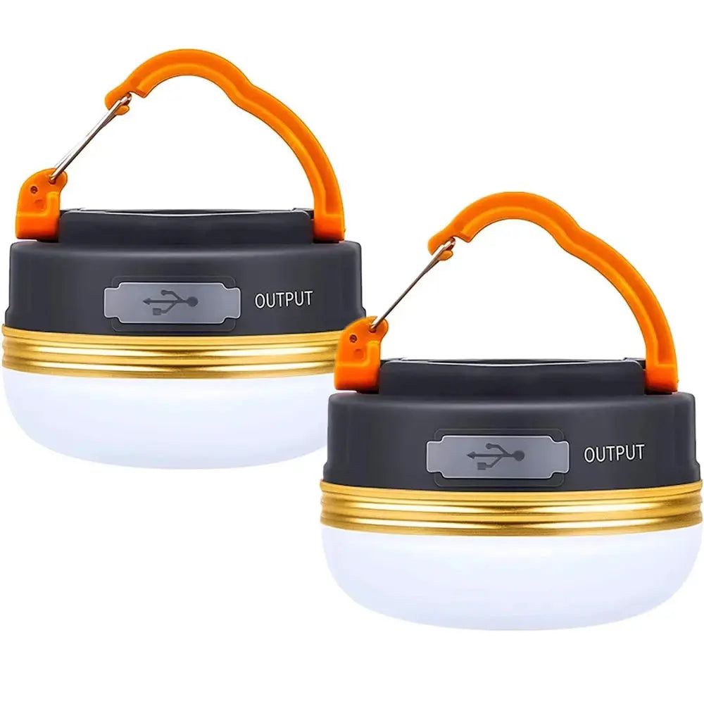 Two USB-rechargeable camping lanterns with gray bodies and orange handles.