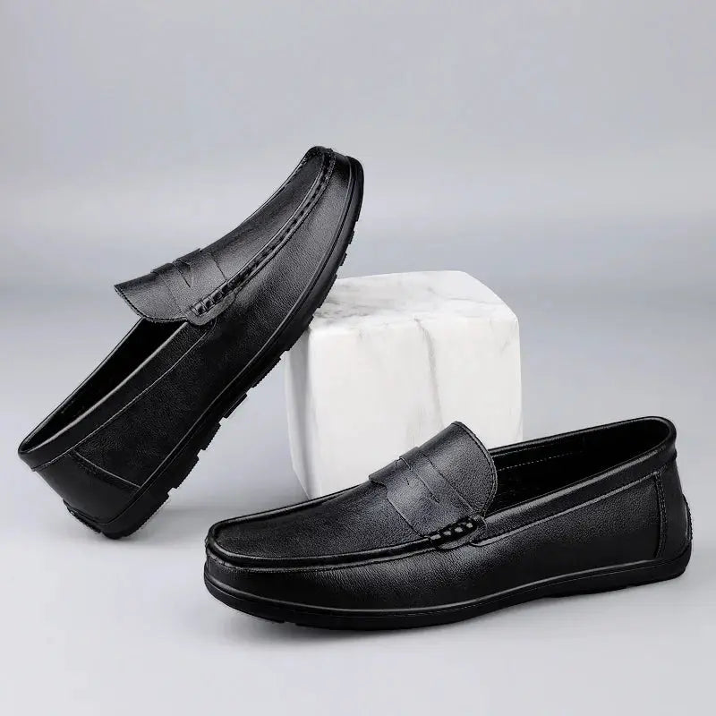 Pair of black genuine leather men's loafers with slip-on design