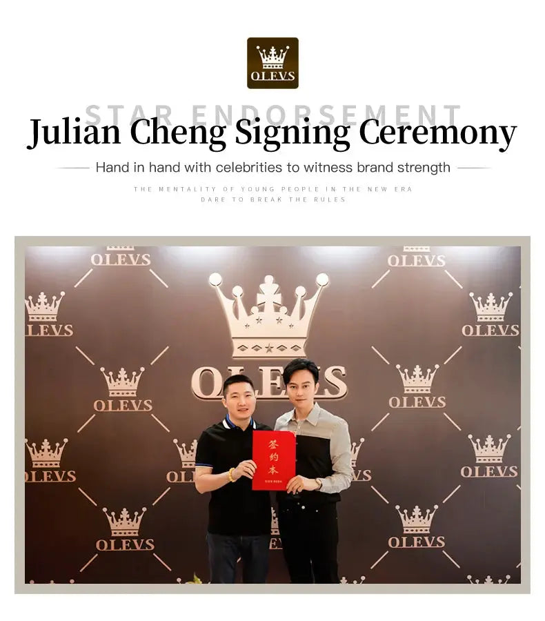 OLEVS branding event photo with crown-logo backdrop; two men pose holding a red booklet