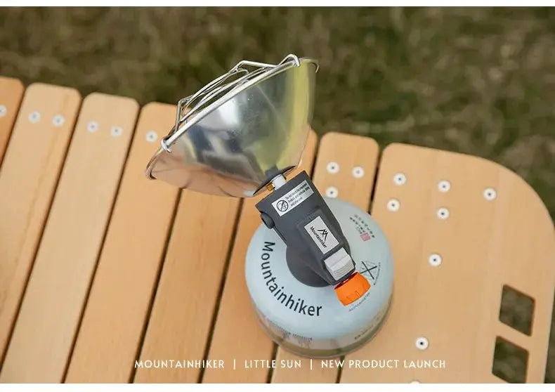 Mountainhiker portable mini sun gas stove with reflector on blue butane canister