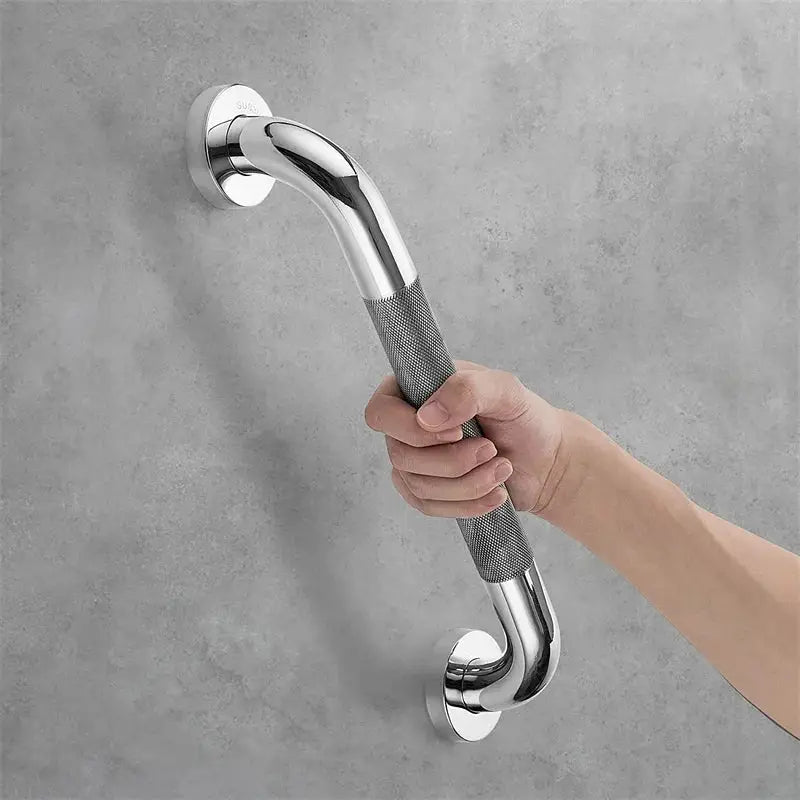 Bathroom grab bar by Simples Market; stainless steel, curved wall-mounted with knurled grip.