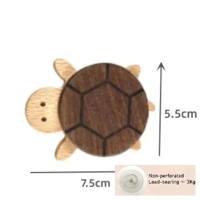 Solid wood turtle wall hook by Simples Market for kids' rooms; natural wood with dark brown shell, 5.5 × 7.5 cm.