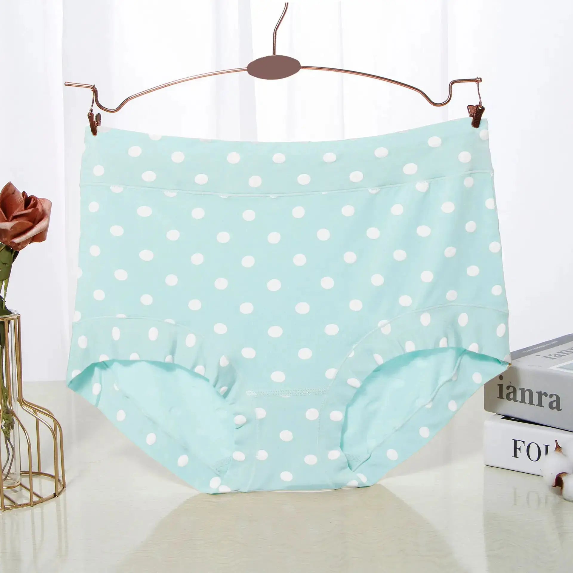 Panties from Simples Market, light-blue polka dot high-waist on copper hanger.