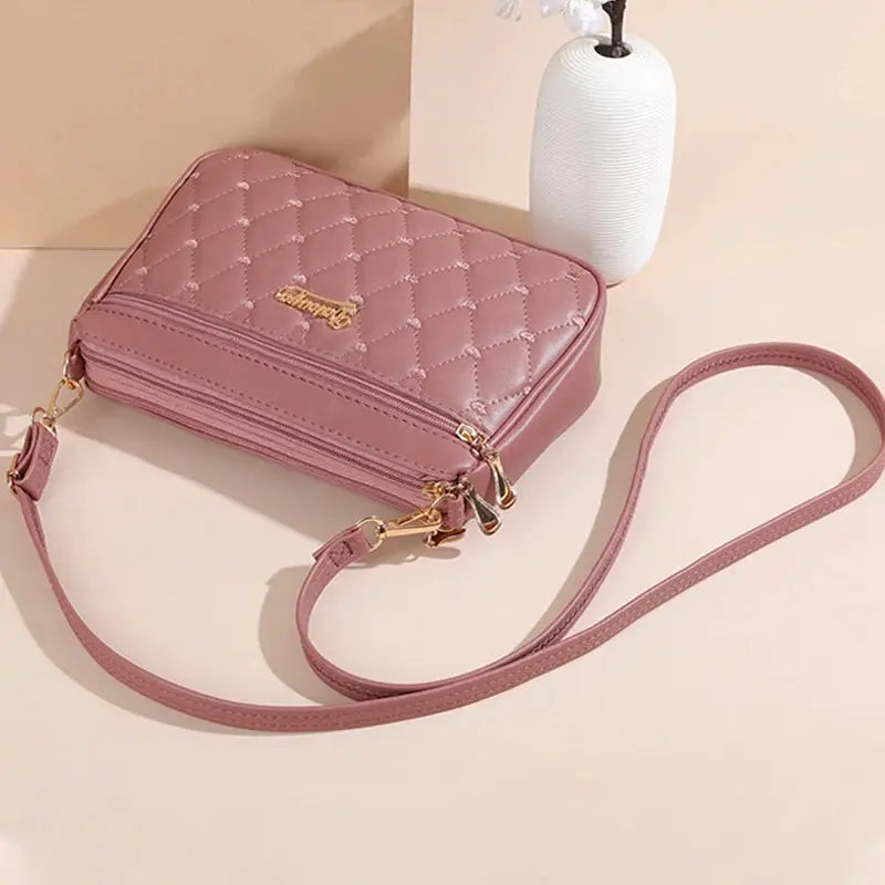 PU leather crossbody bag by Simples Market, pink quilted shoulder bag with gold hardware and long strap