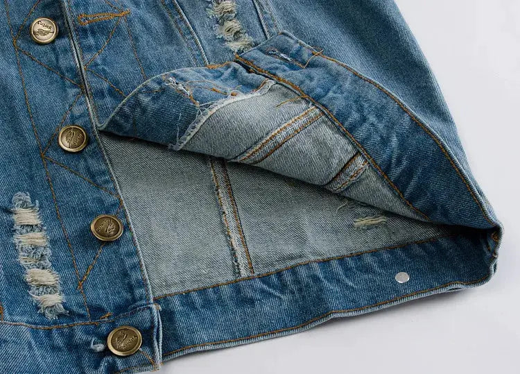 Men's light blue distressed denim jacket with ripped patches and metal buttons.