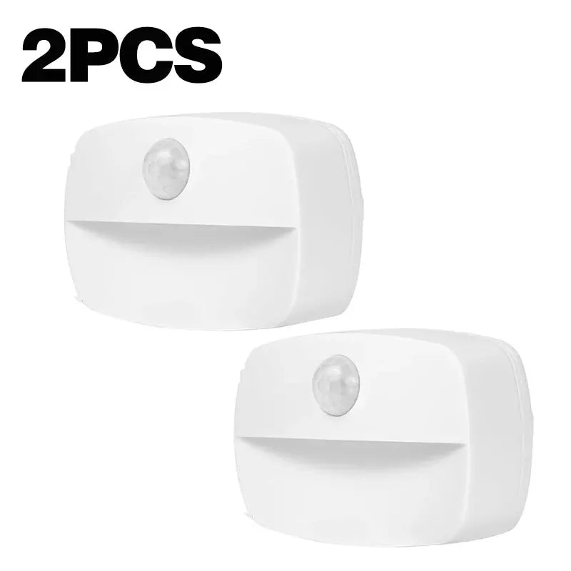 Simples Market 2-pack white LED motion-sensor night lights, wireless battery-powered.