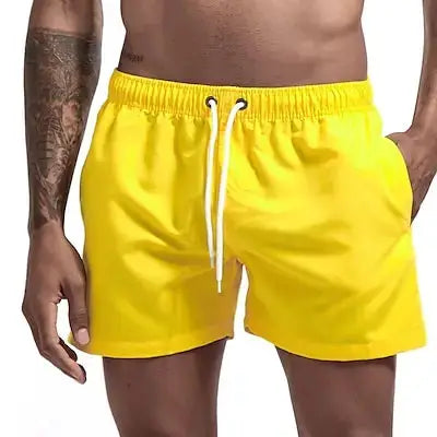 Men's yellow quick-dry board shorts with white drawstring and pockets