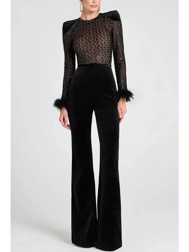 Women's black velvet jumpsuit with sheer lace bodice, long sleeves and feather-trim cuffs, wide-leg pants.