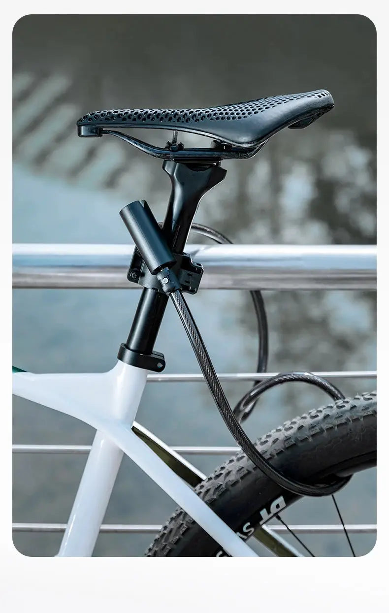 RockBros bicycle lock with keys, black zinc-alloy body and cable wrapped around a white bike seat post.