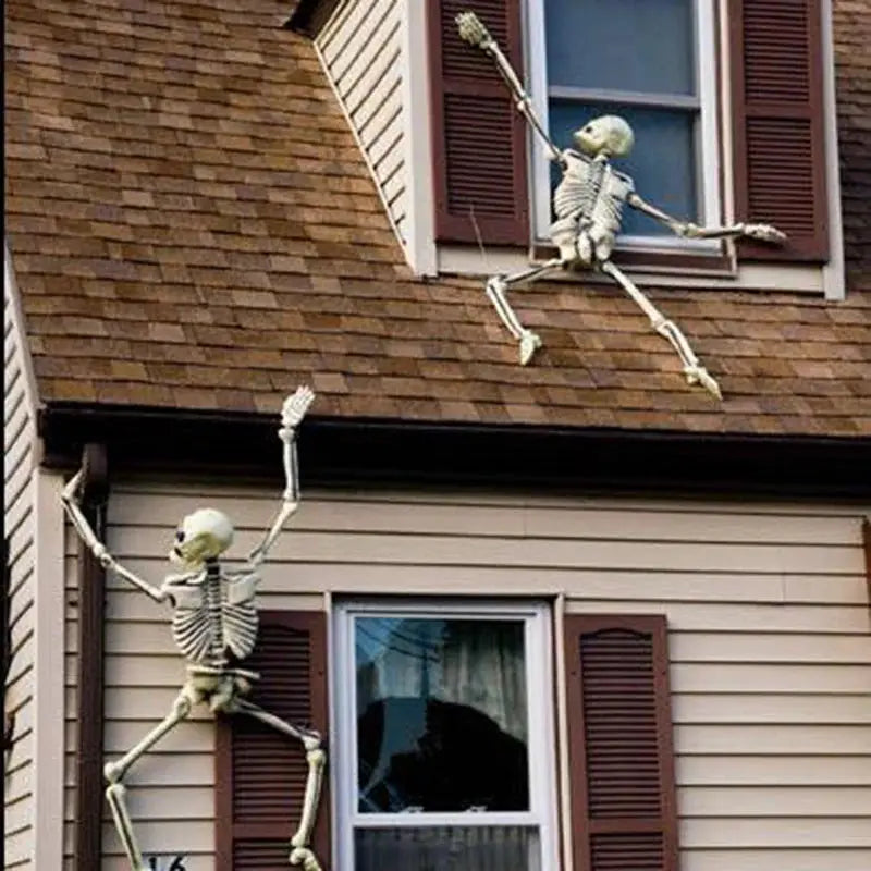 Happy Halloween humanoid skeleton decorative prop by Simples Market; two off-white skeletons on a house exterior.