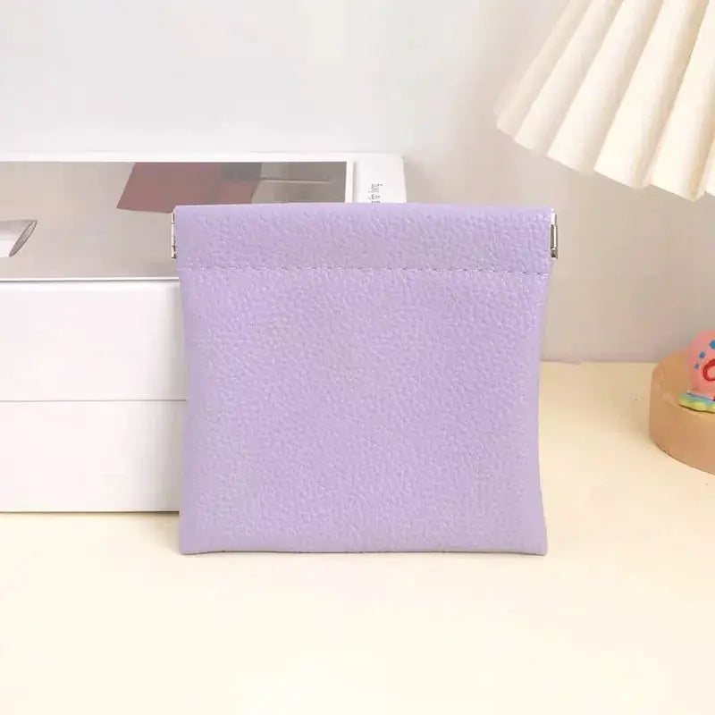 Simples Market lavender faux-leather long wallet with self-closing top and textured surface.