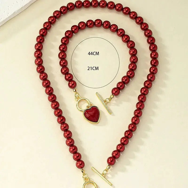 2-piece red imitation pearl necklace and bracelet set with gold-tone heart pendant