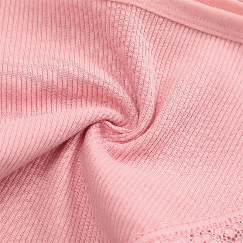 Women's pink ribbed cotton briefs with lace trim, solid color underwear.