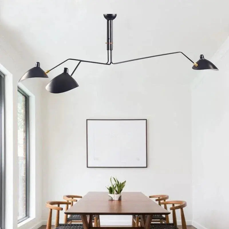 Mouille 3-head black matte pendant ceiling lamp by Simples Market over a dining table